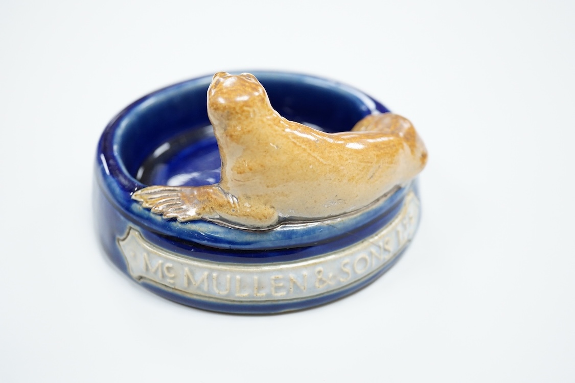 A Doulton ‘silver seal port’ advertising ashtray, 13cm wide (a.f)